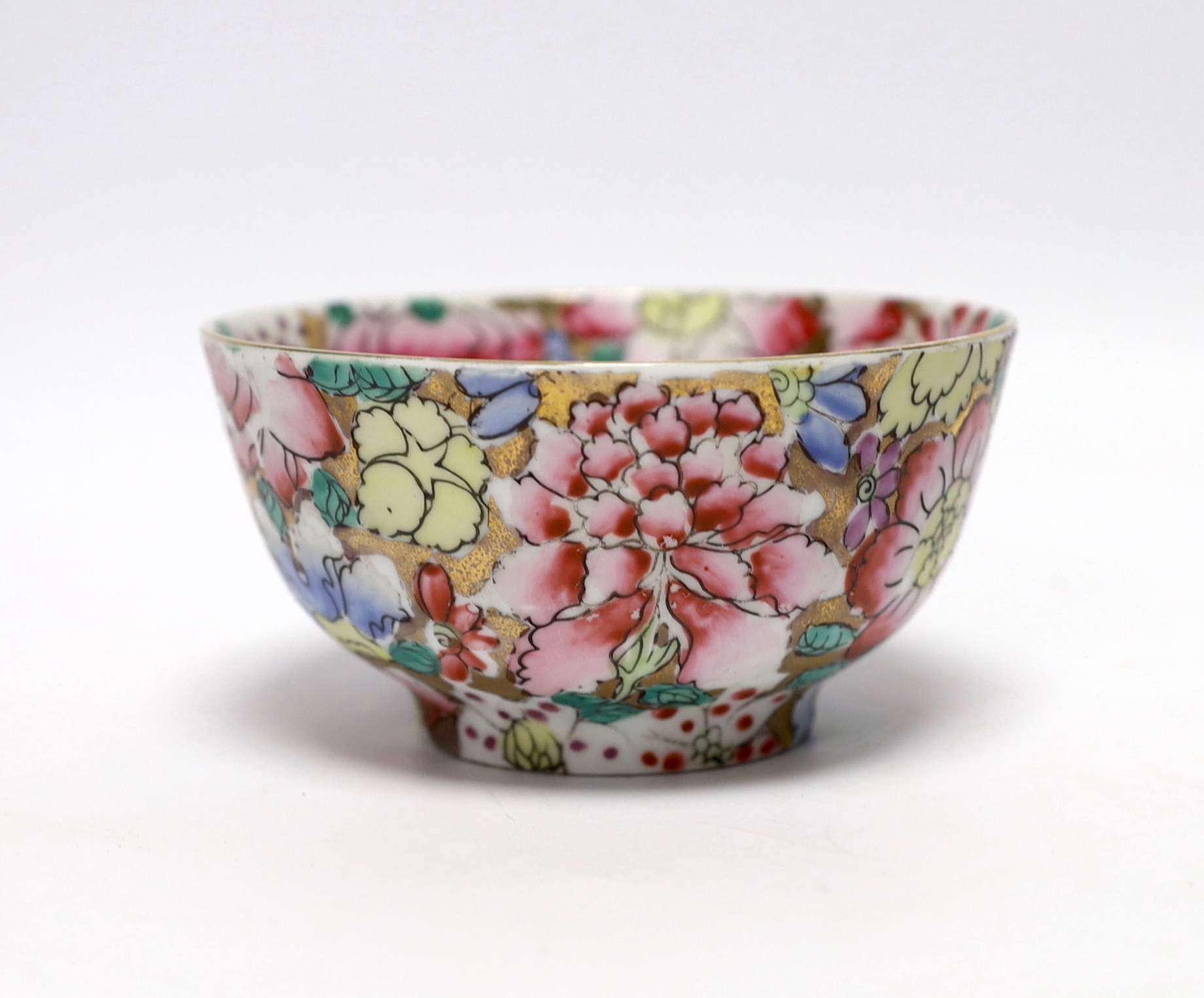 A small circular Chinese porcelain bowl having polychrome 'millefiore' and gilt decoration, diameter 11.5cm, red seal mark to base